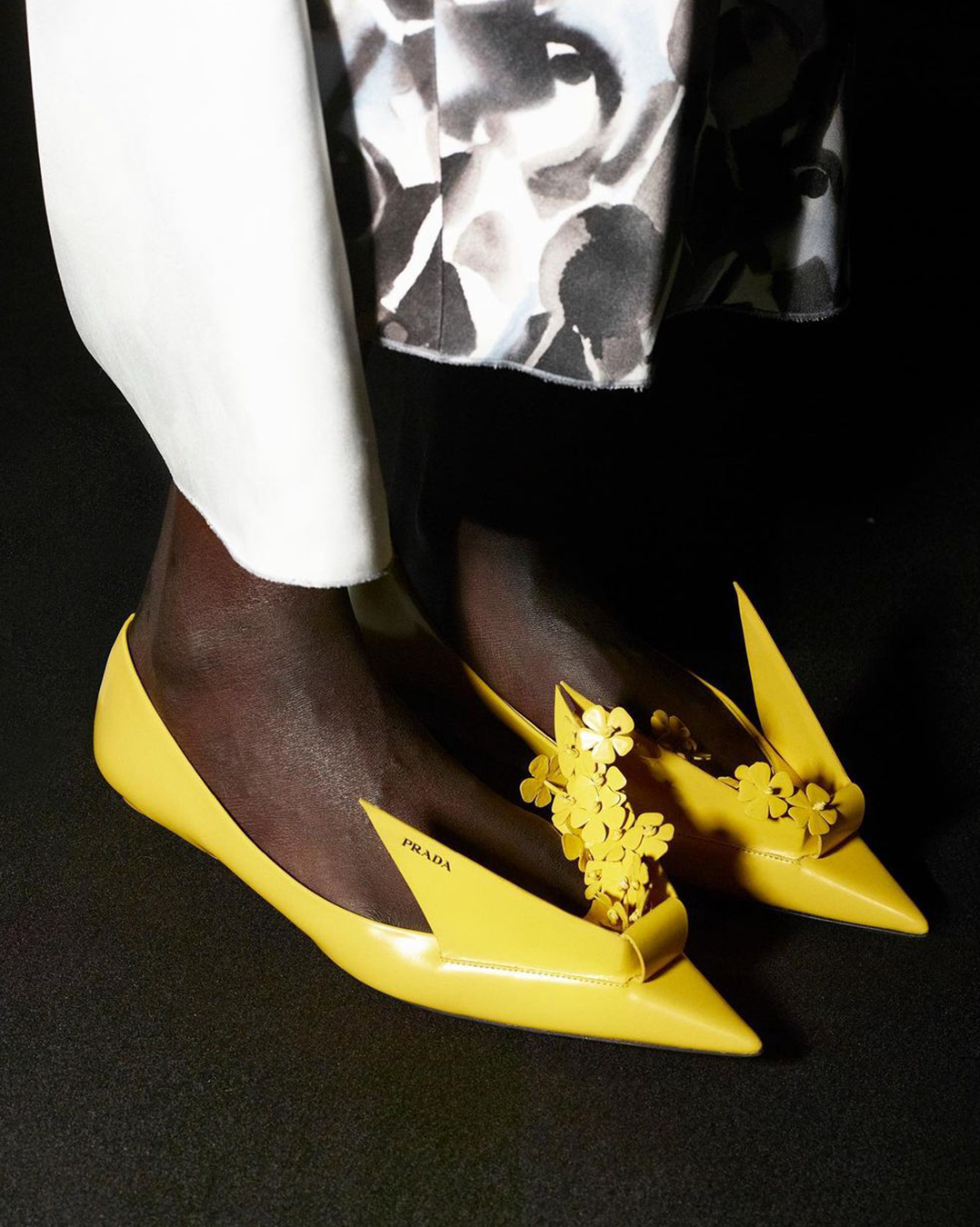 LILIES, PUFFERS, & ORIGAMI SHOES: KEY TAKEAWAYS FROM PRADA FW23