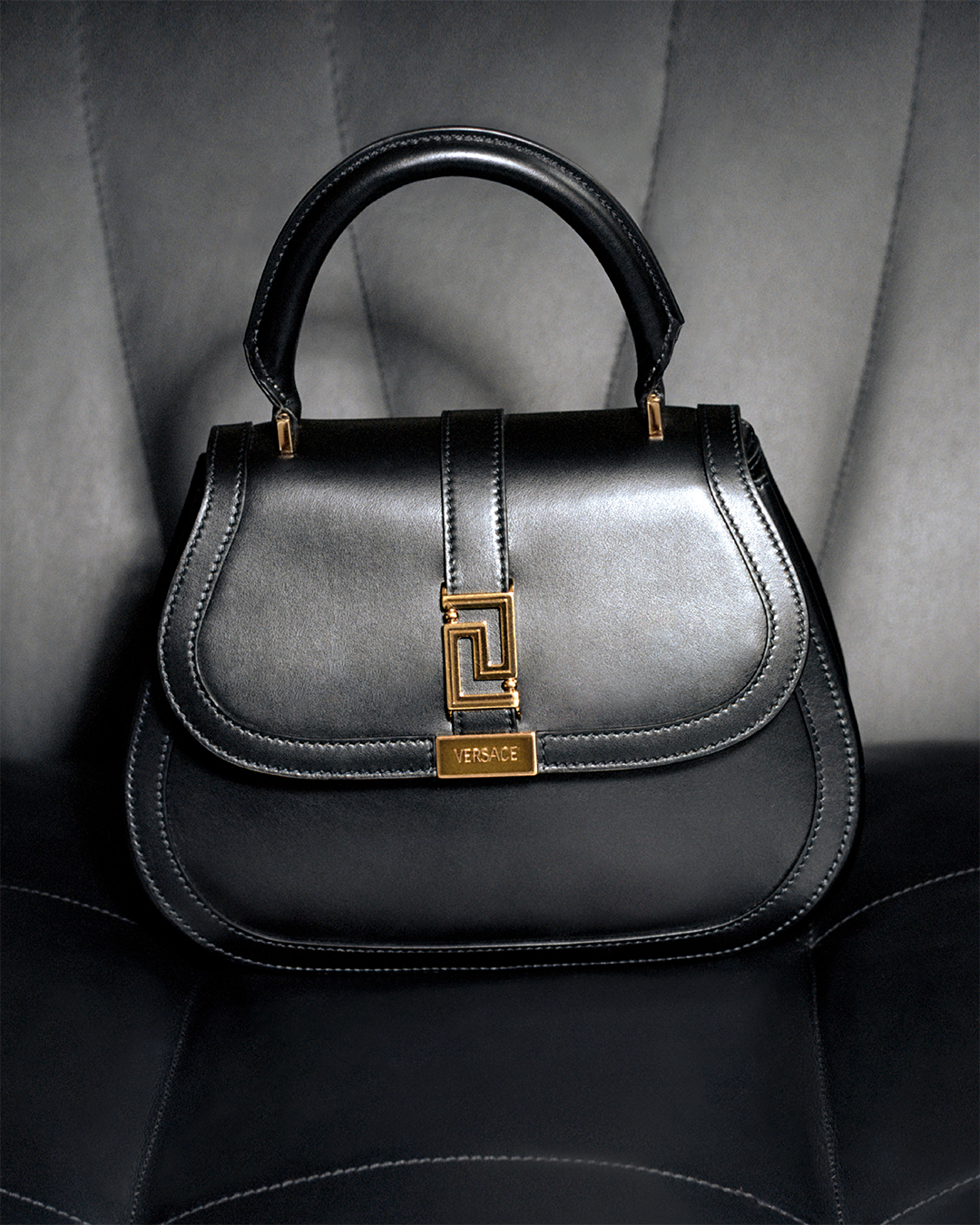 The Versace Greca Goddess top handle bag is from a higher being