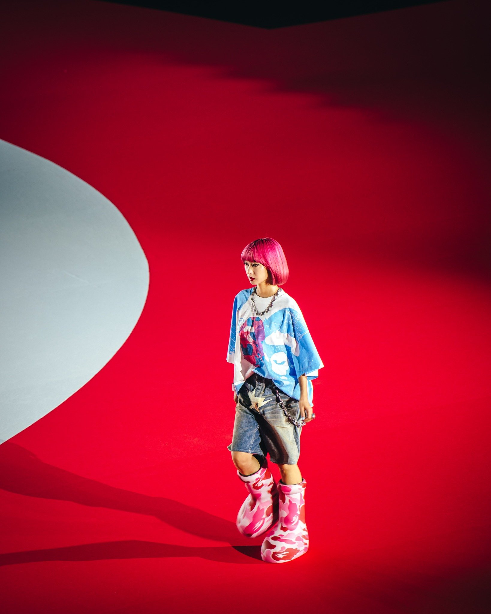 BAPE debuts MSCHF Big Red Boot Camouflage Limited Edition Collaboration for 30th anniversary of A BATHING APE at Japan runway show.